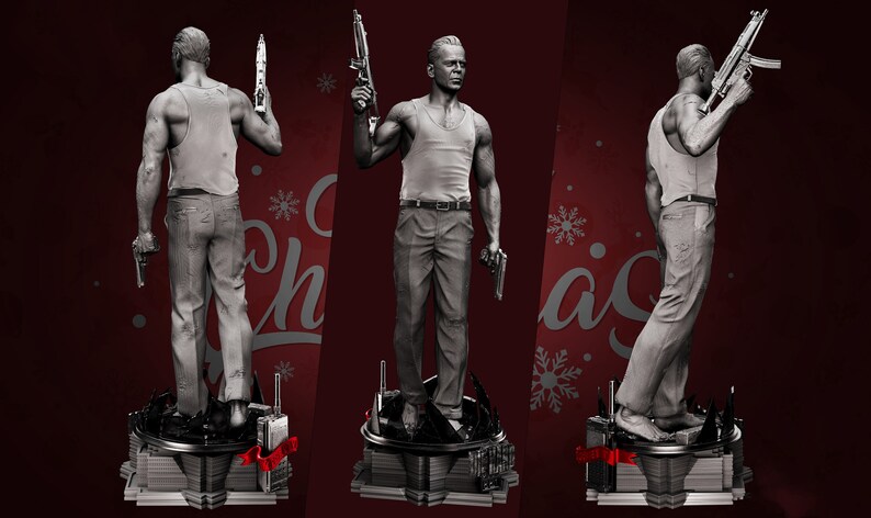 May include: A gray figurine of a man holding a gun in each hand. The figurine is standing on a black base with a red ribbon. The background is red with snowflakes.