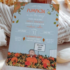 May include: A baby shower invitation with a pumpkin theme. The invitation features the text "A New Little Pumpkin is on the Way!" and "Welcome Great Baby!" with a cartoon illustration. The invitation is surrounded by fall foliage and pumpkins.