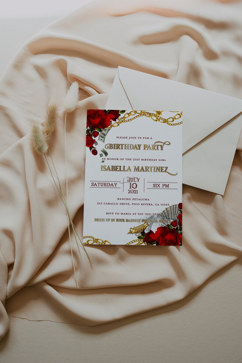 May include: A white invitation card with gold lettering and a red rose design. The text reads "Please join us for a Birthday Party in honor of the 21st birthday girl Isabella Martinez. Saturday, July 10, 2021, Six PM. Rancho Petaluma, 213 Caballo Drive, Pico Rivera, CA 12345. RSVP to Maria at 555-555-5550. Dress up in your baddest birthday attire."