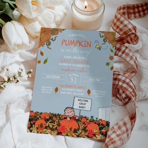 May include: A baby shower invitation with a light blue background and fall-themed graphics. The invitation includes the text "A new little pumpkin is on the way!" and "Welcome Great Baby!" The invitation is surrounded by white flowers, a lit candle, and a ribbon.