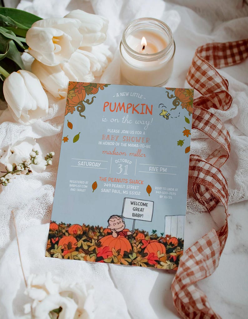 May include: A baby shower invitation with a light blue background and fall-themed graphics. The invitation includes the text "A new little pumpkin is on the way!" and "Welcome Great Baby!" The invitation is surrounded by white flowers, a lit candle, and a ribbon.