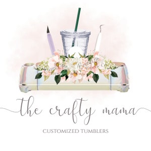 May include: A white and pink floral design with a clear tumbler, a purple pen, and a white tool. The text "The Crafty Mama" and "Customized Tumblers" is below the design.