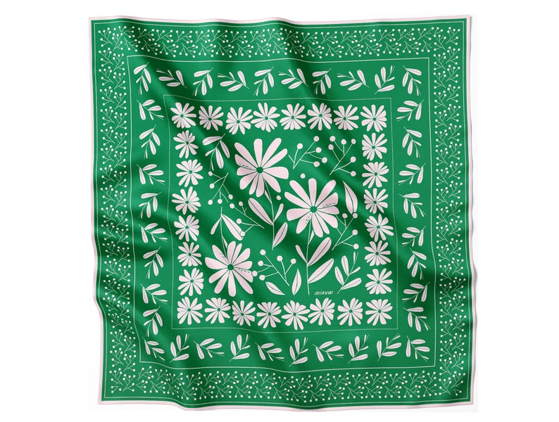 May include: A green square silk scarf with a white floral pattern. The pattern features stylized flowers and leaves.