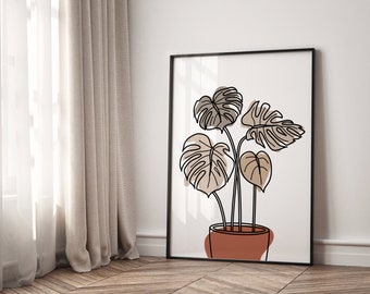 May include: A black framed print with a line drawing of a potted plant with brown leaves. The plant is in a terracotta pot.