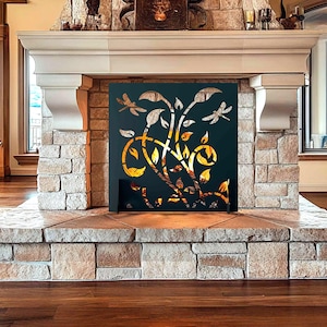 May include: A black metal fireplace screen with a decorative floral design featuring dragonflies. The screen is installed in a stone fireplace with a hearth.