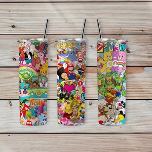 May include: Three stainless steel tumblers with colorful 80s cartoon character designs. The designs include characters from The Care Bears, Teenage Mutant Ninja Turtles, Cabbage Patch Kids, and more.