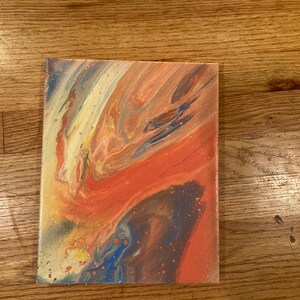 May include: Abstract painting on canvas with swirling colors of orange, yellow, blue, and brown.
