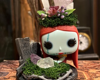 Figura pop de jardín de cristal de Sally