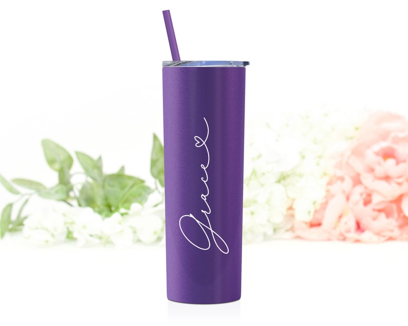 Personalized 20 ounce stainless steel tumbler shown in matte purple with white print. Includes lid and matching straw.