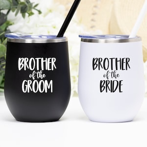 May include: Two stainless steel wine tumblers with lids and straws. One tumbler is black with the text "Brother of the Groom" in white. The other tumbler is white with the text "Brother of the Bride" in black.