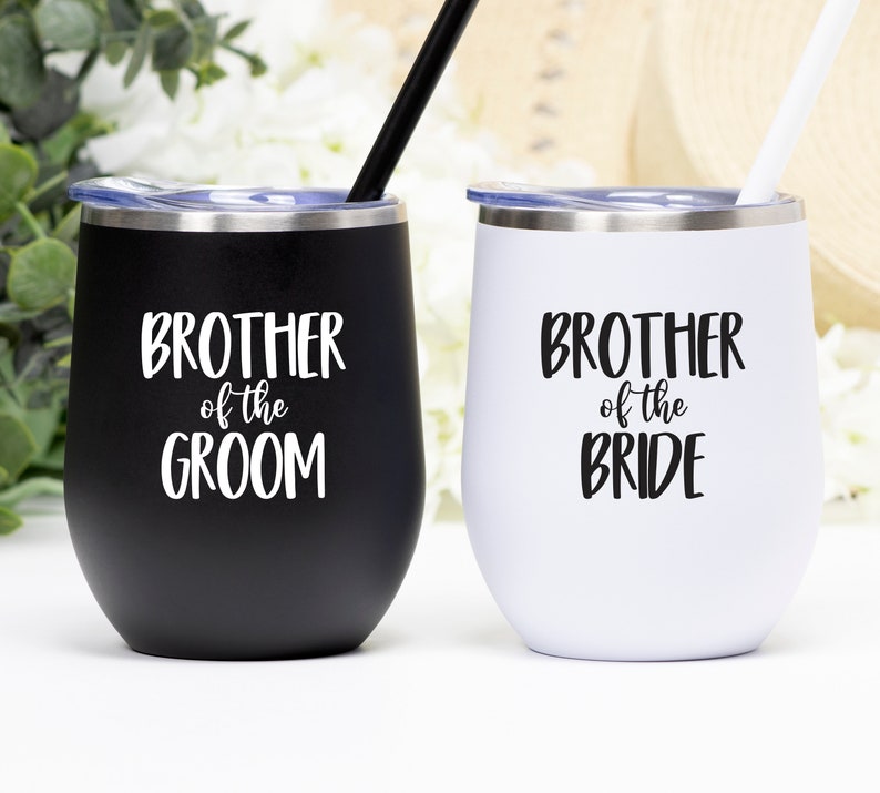 May include: Two stainless steel wine tumblers with lids and straws. One tumbler is black with the text "Brother of the Groom" in white. The other tumbler is white with the text "Brother of the Bride" in black.