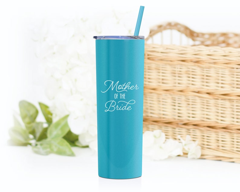 20 ounce stainless steel Mother of the Bride tumbler with lid and straw. Mothe of the bride is UV printed on the front in white print which shows well on our Matte Caribbean Cool tumbler.
