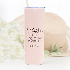 20 ounce stainless steel tumbler with lid and straw. UV printed mother of the bride with wedding date on the front in black print. A great gift for mom!