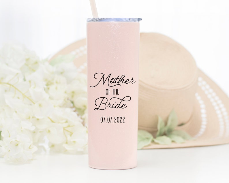 20 ounce stainless steel tumbler with lid and straw. UV printed mother of the bride with wedding date on the front in black print. A great gift for mom!