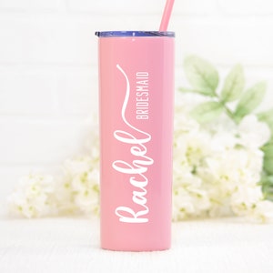 20 ounce stainless steel bridesmaid tumbler personalized with UV print name and optional title.  Shown in pink with white print.  Includes straw and lid. Made with direct UV print personalization.