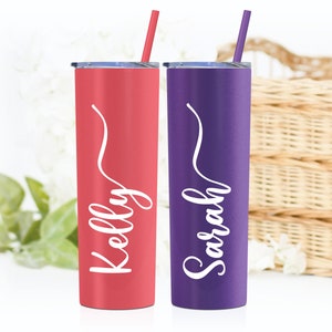 Personalized 20 ounce stainless steel tumbler with name, includes lid and straw. Shown in Matte Coral and Matte Grape with white print. A title can be added for bridesmaid, maid of honor, matron of honor, mother of the bride, and entire wedding party
