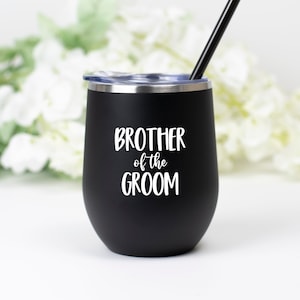 May include: Black stainless steel tumbler with a white inscription that reads "Brother of the Groom".
