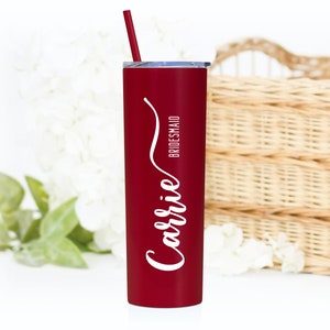 20 ounce personalized stainless steel tumbler with name and title. Shown in matte red with white print. Includes lid and matching straw.
