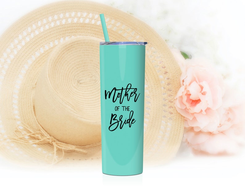 Mother of the bride tumbler shown in Mint with black print. Includes lid and matching straw. 20 ounce stainless steel tumbler.