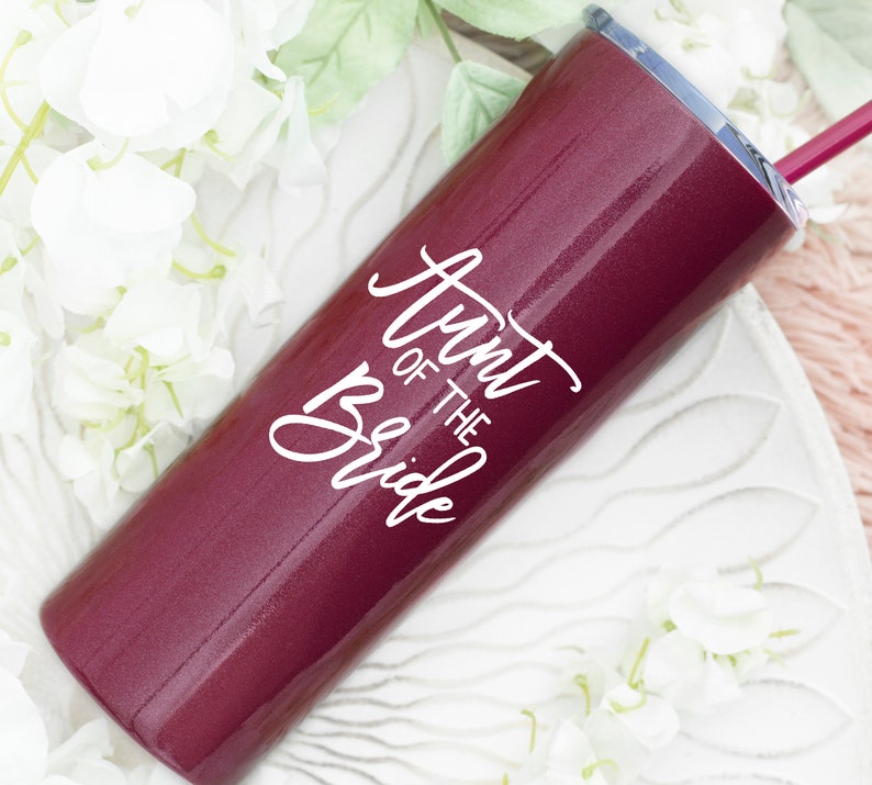 20 ounce stainless steel tumbler with aunt of the bride or groom printed on the front.  Includes lid and straw. Personalized with direct UV print.