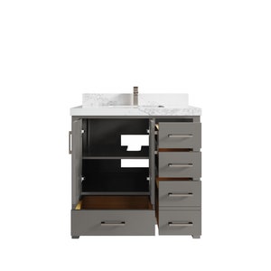 May include: A grey bathroom vanity with a white countertop and a single sink. The vanity has two doors and four drawers, all of which are open to reveal the interior.