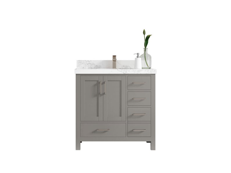 May include: A grey bathroom vanity with a white marble countertop and brushed nickel hardware. The vanity has two doors and four drawers.