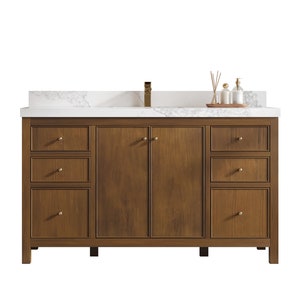 May include: A brown wooden bathroom vanity with a white countertop and three drawers on each side. The vanity has two doors in the center with gold hardware.