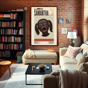 May include: A framed poster titled "Samantha" with a graphic illustration of a screaming face with pigtails. The poster is displayed in a living room with a brick wall, bookshelves, and a sofa. The poster is part of the "Minor Dungeon Deity" series.