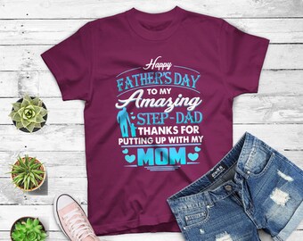 May include: Burgundy t-shirt with a blue graphic that says "Happy Father's Day to my Amazing Step-Dad Thanks for putting up with my Mom".