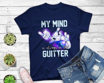 May include: A navy blue t-shirt with a bowling ball graphic and the text "MY MIND is always in the GUTTER".