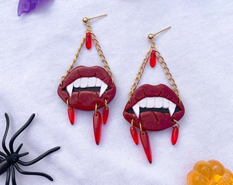 bloody vampire bite polymer clay earrings with glass beads