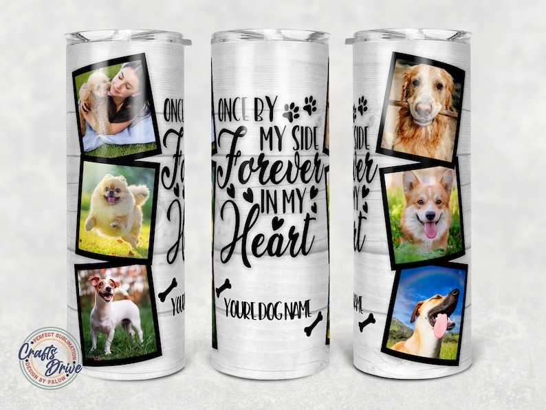 May include: White tumbler with a woodgrain background and black text that reads "Once by my side forever in my heart." The tumbler features multiple photos of dogs in black frames.