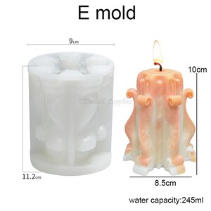 May include: A white silicone candle mold with four cavities, each shaped like a decorative candle with a fluted design. The mold is 9 inches wide and 11.2 inches tall. A finished candle is shown next to the mold, measuring 8.5 inches wide and 10 inches tall. The candle is a light peach color with a white wick. The text "E mold" is printed above the image. The text "water capacity: 245ml" is printed below the image.