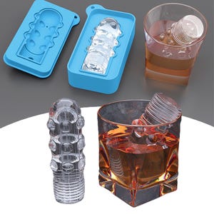 May include: Two clear silicone ice molds with a design of a textured cylinder. The molds are blue and light blue. A glass of amber liquid with a clear ice cube in it. The ice cube has a textured cylinder design.