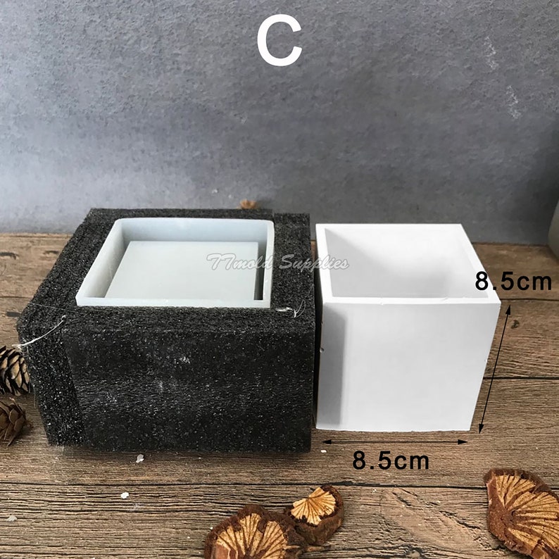 May include: A white silicone mold for making square planters. The mold is 8.5 inches wide and 8.5 inches long.
