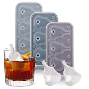 May include: Three clear silicone ice cube trays with a pear-shaped design. Each tray has six pear-shaped ice cube moulds. Two clear pear-shaped ice cubes are shown on a white surface.