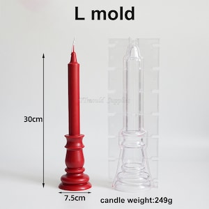 May include: A clear plastic candle mold with a red candle in a matching mold. The candle is 30 inches tall and the base is 7.5 inches wide. The candle weighs 249 grams. The mold is labeled "L mold".