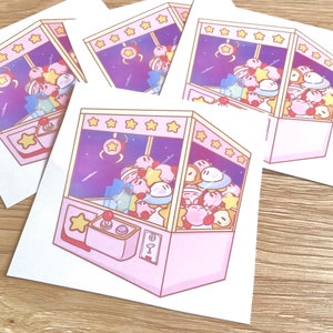 Impression de machine à griffes d'arcade rose kawaii