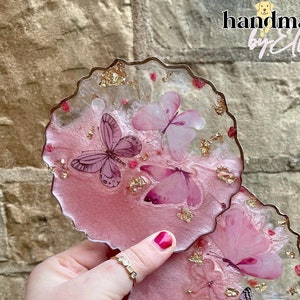 Pink and gold dried flower coaster with butterfly inserts
