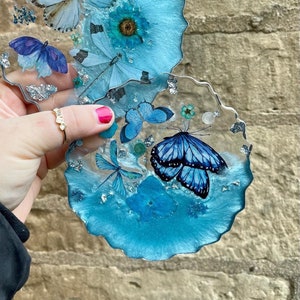 Blue and silver coaster with dried flowers and butterfly inserts