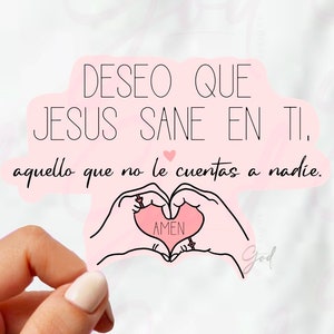 May include: Pink sticker with the text "DESEO QUE JESUS SANE EN TI. aquello que no le cuentas a nadie. AMEN" and a hand drawn heart with the word "AMEN" inside.