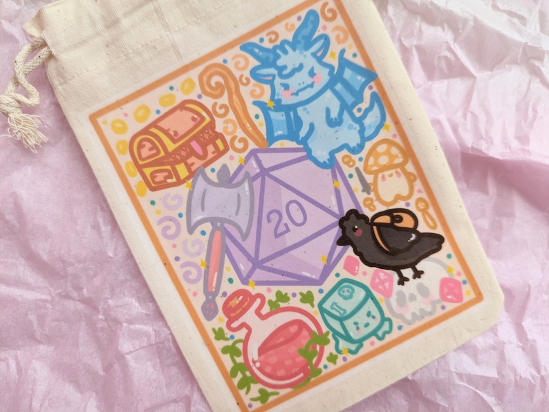 May include: A white drawstring bag with a colorful illustration of a 20-sided die, a chest, a dragon, a potion bottle, a crow, and other fantasy-themed items.