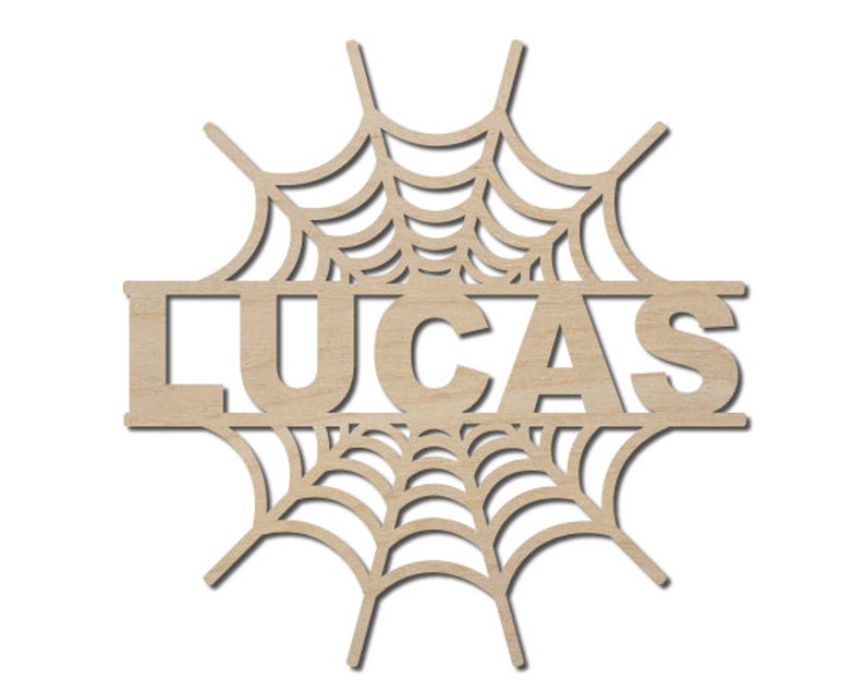May include: Wooden cutout of a spiderweb with the name "LUCAS" in the center. The cutout is a popular Halloween decoration.