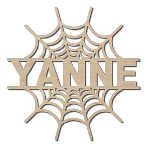 May include: Wooden cutout of a spiderweb with the name "YANNIE" in the center.