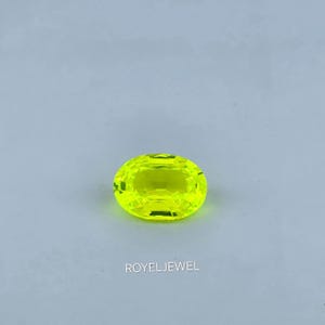 Yellow Lab-Created LuAG Garnet: 24.70 ct Oval Cut Gemstone