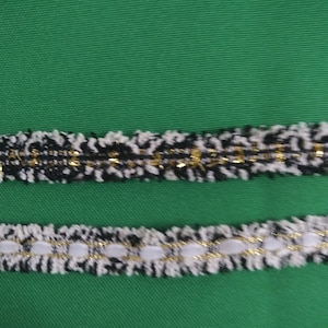 White gold black trim boucle lurex trim.