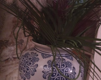 Chinoiserie vase with tropical faux flowers and faux Fens.