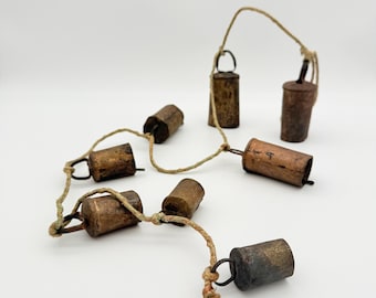Antique Cow Bells on Cord Set of 8 Vintage Cattle Bells Rustic Farmhouse Cottagecore Wall Decor Old Hanging Bells