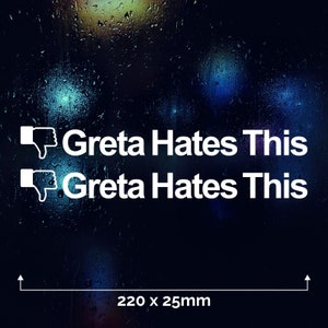 May include: White vinyl sticker with a thumbs down emoji and the text "Greta Hates This" repeated twice. The sticker is on a dark blue background with blurry lights. The sticker measures 220 x 25 mm.