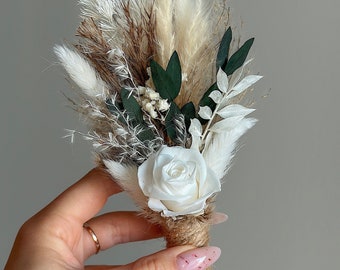 Boho dried flowers groom boutonniere for luxury wedding with natural, white and green rustic preserved flowers and pampas grass